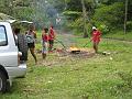 People celebrating Emancipation Day by roasting cashews on the beach during our Margaratoulle Falls Hike